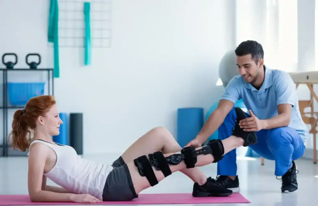 Woman having treatment to help muscle recovery Slough 	 after an injury